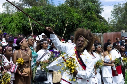 Traditionally decorated Oromos headed by a man with baboon skin head dress